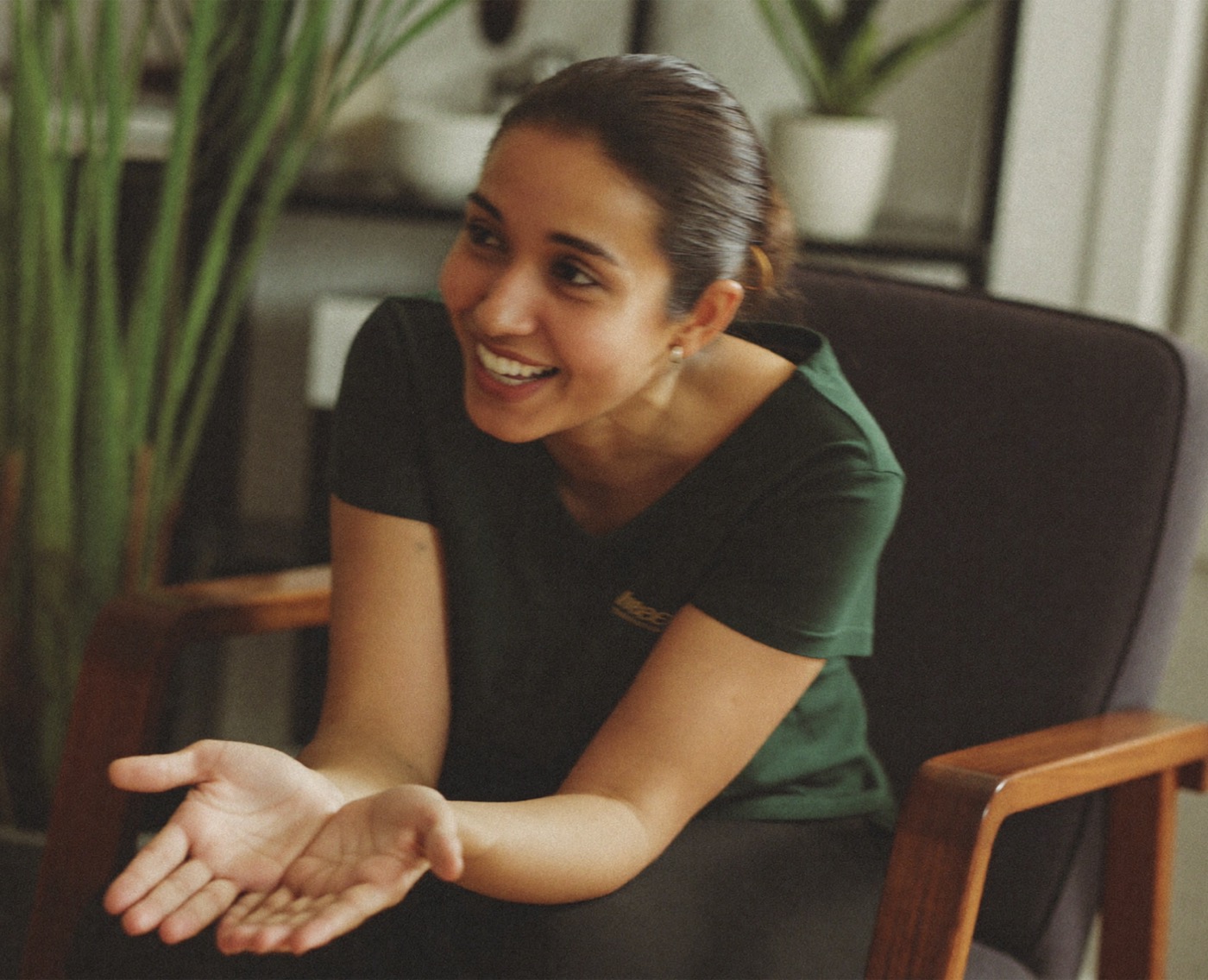 A founder in conversation, gesturing as she explains her IP strategy